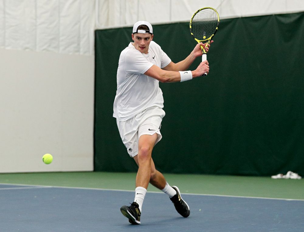 Iowa’s Joe Tyler returns a shot during his singles match at the Hawkeye Tennis and Recreation Complex in Iowa City on Sunday, February 16, 2020. (Stephen Mally/hawkeyesports.com)
