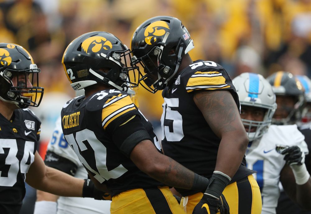 Iowa Hawkeyes defensive lineman Cedrick Lattimore (95) and linebacker Djimon Colbert (32) against Middle Tennessee State Saturday, September 28, 2019 at Kinnick Stadium. (Brian Ray/hawkeyesports.com)