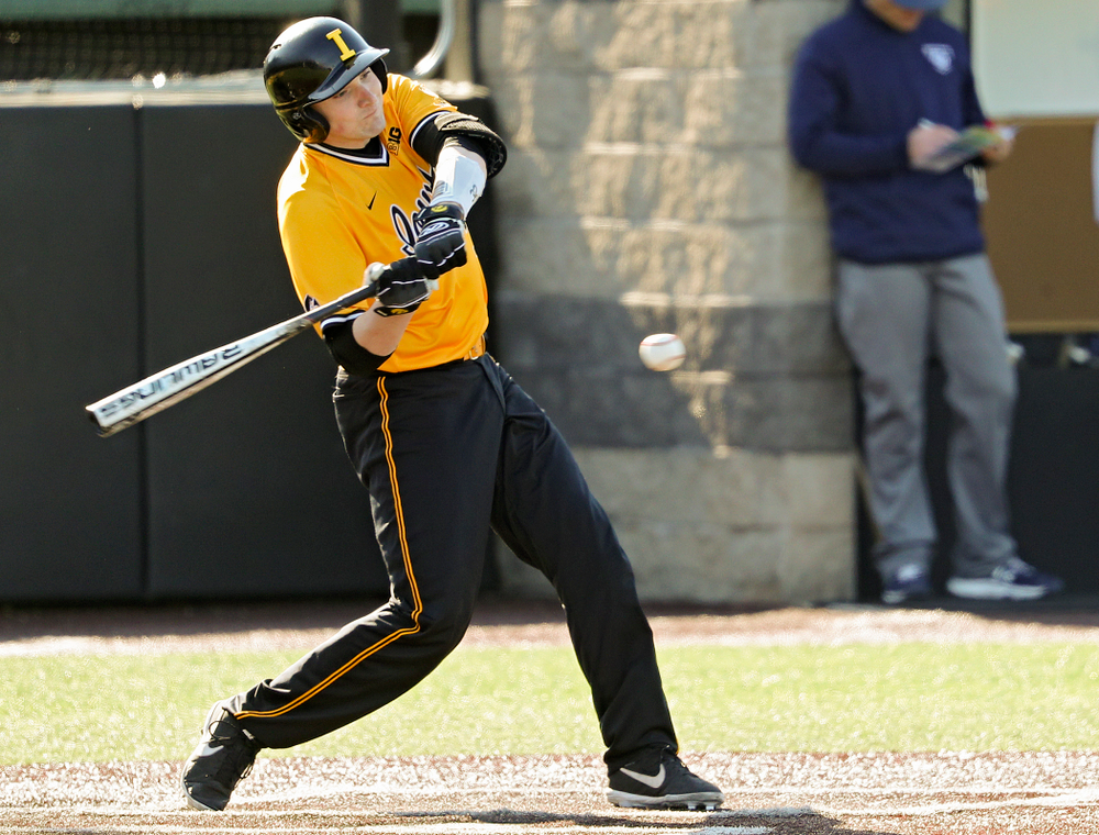 Iowa Hawkeyes catcher Brett McCleary (32) drives a pitch for a hit during the second inning of their game at Duane Banks Field in Iowa City on Tuesday, Apr. 2, 2019. (Stephen Mally/hawkeyesports.com)
