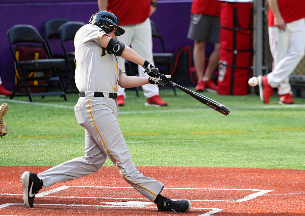 Iowa Hawkeyes first baseman Peyton Williams (45) drives a pitch for a double during the fifth inning of their CambriaCollegeClassic game at U.S. Bank Stadium in Minneapolis, Minn. on Friday, February 28, 2020. (Stephen Mally/hawkeyesports.com)