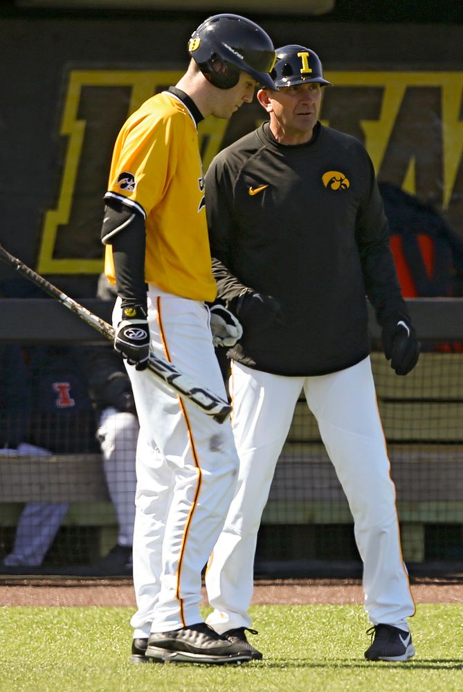 Iowa Hawkeyes Connor McCaffery (30) talks with head coach Rick Heller during the third inning against Illinois at Duane Banks Field in Iowa City on Sunday, Mar. 31, 2019. (Stephen Mally/hawkeyesports.com)