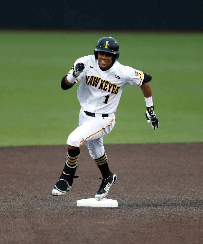 Iowa Hawkeyes third baseman Lorenzo Elion (1) triples against Coe College Wednesday, April 11, 2018 at Duane Banks Field. (Brian Ray/hawkeyesports.com)