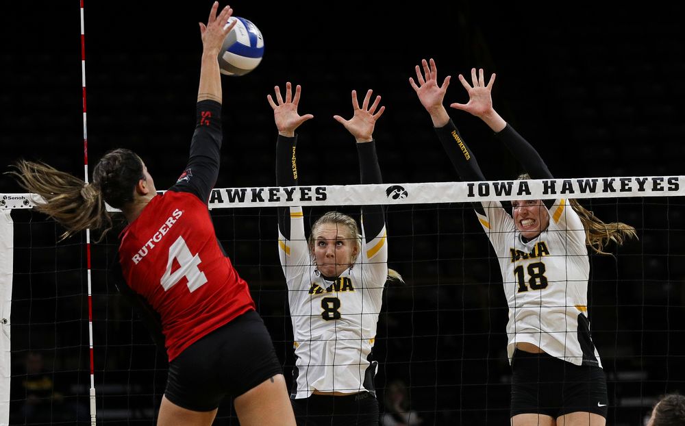 Iowa Hawkeyes right side hitter Reghan Coyle (8) and Iowa Hawkeyes middle blocker Hannah Clayton (18) go up for a block during a match against Rutgers at Carver-Hawkeye Arena on November 2, 2018. (Tork Mason/hawkeyesports.com)