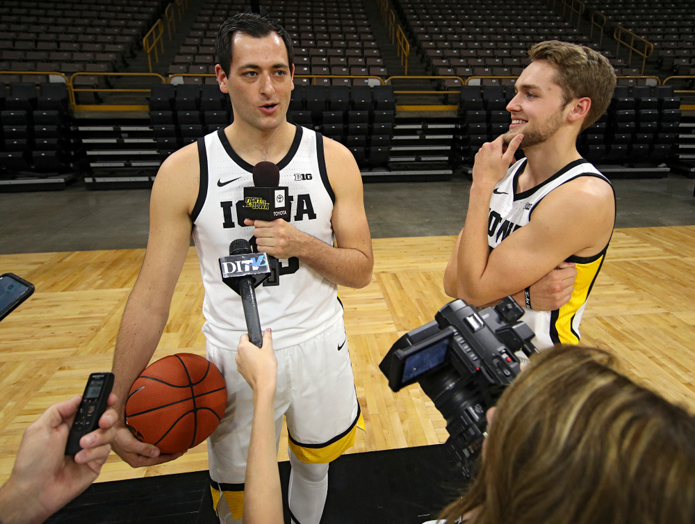 Iowa Hawkeyes forward Ryan Kriener (15) answers a question from forward Riley Till (20) during Iowa Men’s Basketball Media Day at Carver-Hawkeye Arena in Iowa City on Wednesday, Oct 9, 2019. (Stephen Mally/hawkeyesports.com)