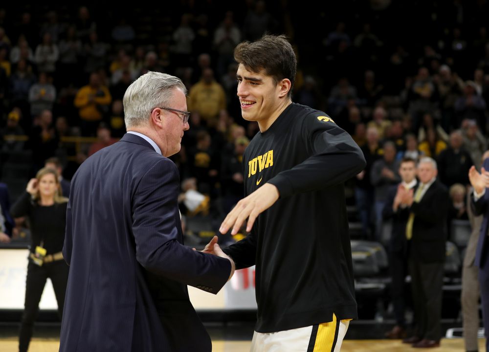 Iowa Hawkeyes forward Luka Garza (55) and head coach Fran McCaffery against the Minnesota Golden Gophers Monday, December 9, 2019 at Carver-Hawkeye Arena. (Brian Ray/hawkeyesports.com)