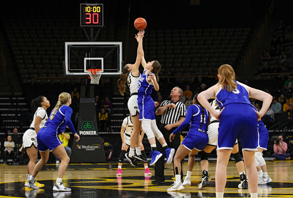Iowa Hawkeyes forward Amanda Ollinger (43) wins the opening tip off during the first quarter of their game at Carver-Hawkeye Arena in Iowa City on Saturday, December 21, 2019. (Stephen Mally/hawkeyesports.com)