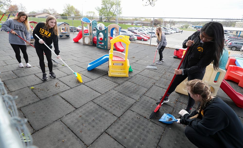 Iowa women's gymnasts clean outside Handicare during the 21st annual ISAAC Hawkeye Day of Caring in Coralville on Sunday, Apr. 28, 2019. (Stephen Mally/hawkeyesports.com)