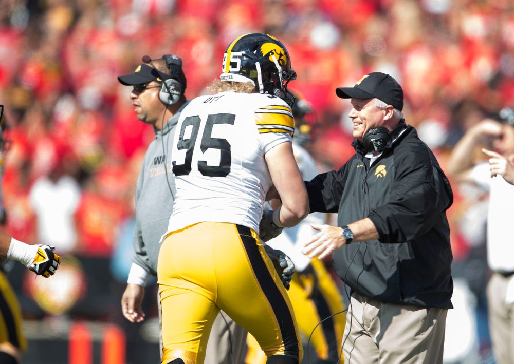 Iowa Hawkeyes defensive lineman Drew Ott (95) celebrates with defensive line coach Reese Morgan after intercepting a pass during the first half of their game Saturday, Oct. 18, 2014 at Byrd Stadium in College Park, Md. (Brian Ray/hawkeyesports.com)
