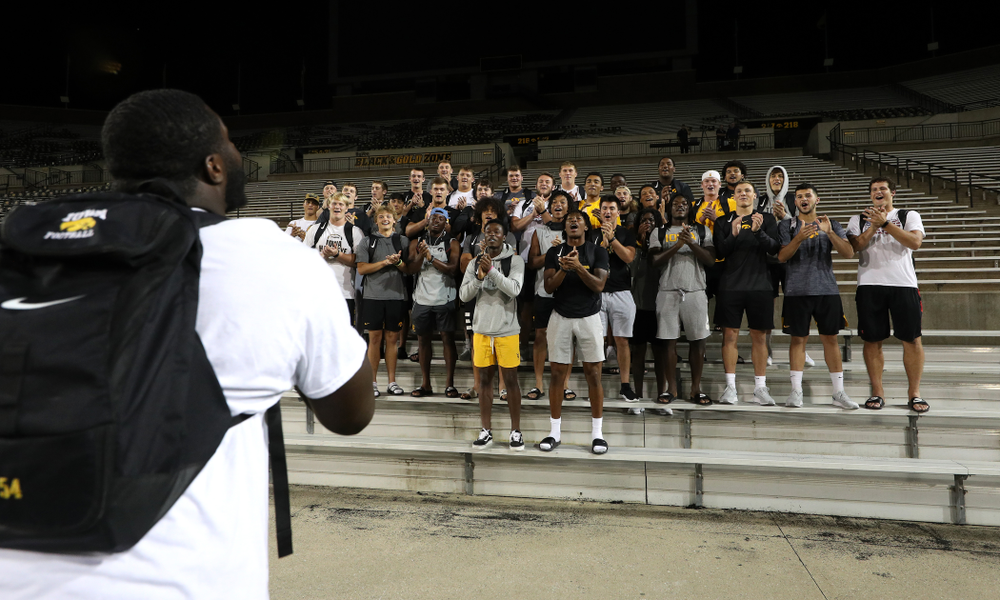 Iowa Hawkeyes defensive tackle Daviyon Nixon (54) leads the new players in a second rendition of the ÒFight SongÓ Thursday, August 22, 2019 at Kinnick Stadium in Iowa City. (Brian Ray/hawkeyesports.com)