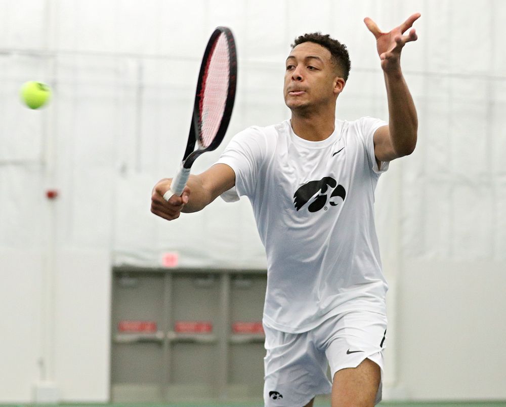 Iowa’s Oliver Okonkwo returns a shot during his doubles match at the Hawkeye Tennis and Recreation Complex in Iowa City on Sunday, February 16, 2020. (Stephen Mally/hawkeyesports.com)