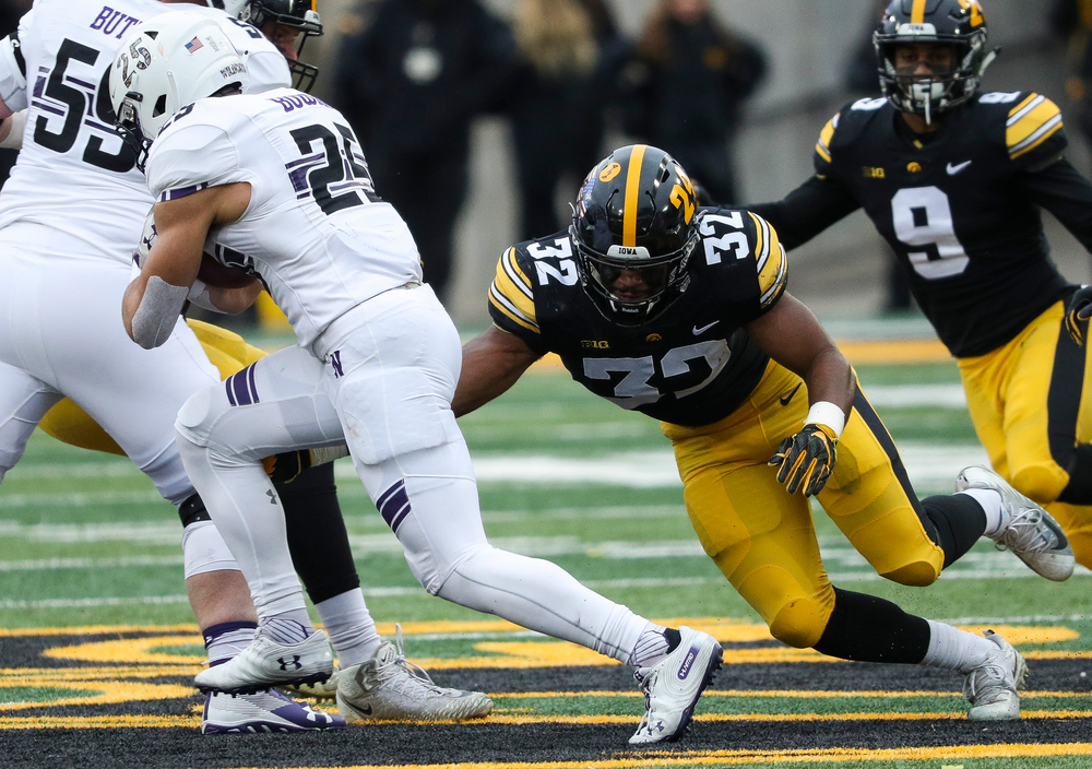 Iowa Hawkeyes linebacker Djimon Colbert (32) makes a tackle during a game against Northwestern at Kinnick Stadium on November 10, 2018. (Tork Mason/hawkeyesports.com)