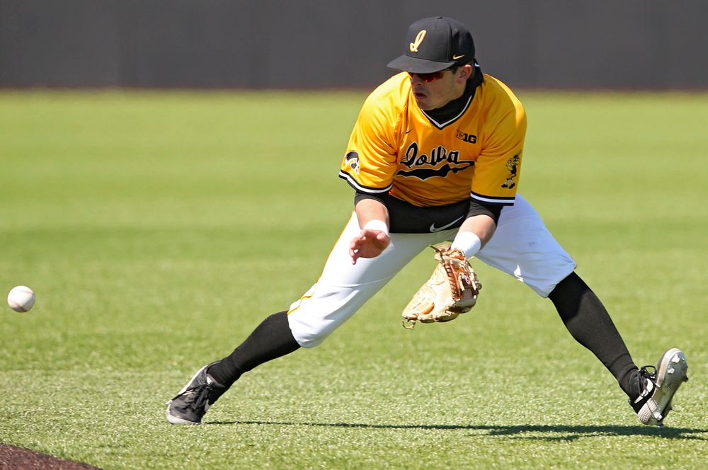 Iowa Hawkeyes second baseman Mitchell Boe (4) fields a ground ball during the fifth inning against Illinois at Duane Banks Field in Iowa City on Sunday, Mar. 31, 2019. (Stephen Mally/hawkeyesports.com)