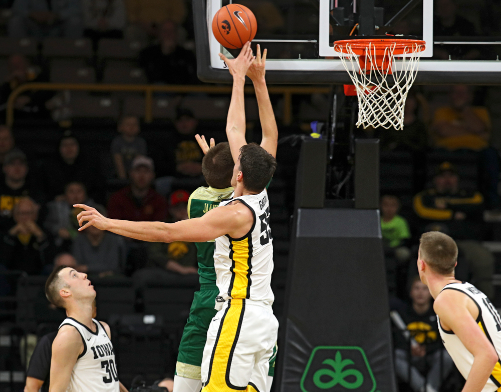 Iowa Hawkeyes center Luka Garza (55) blocks a shot during the first half of their game at Carver-Hawkeye Arena in Iowa City on Sunday, Nov 24, 2019. (Stephen Mally/hawkeyesports.com)