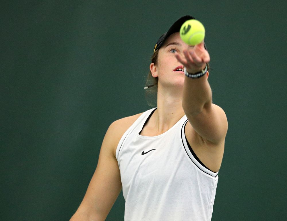 Iowa’s Elise Van Heuvelen serves during her singles match at the Hawkeye Tennis and Recreation Complex in Iowa City on Sunday, February 16, 2020. (Stephen Mally/hawkeyesports.com)