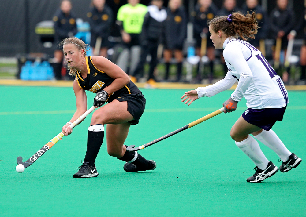 Iowa’s Sophie Sunderland (20) passes during the fourth quarter of their game at Grant Field in Iowa City on Saturday, Oct 26, 2019. (Stephen Mally/hawkeyesports.com)