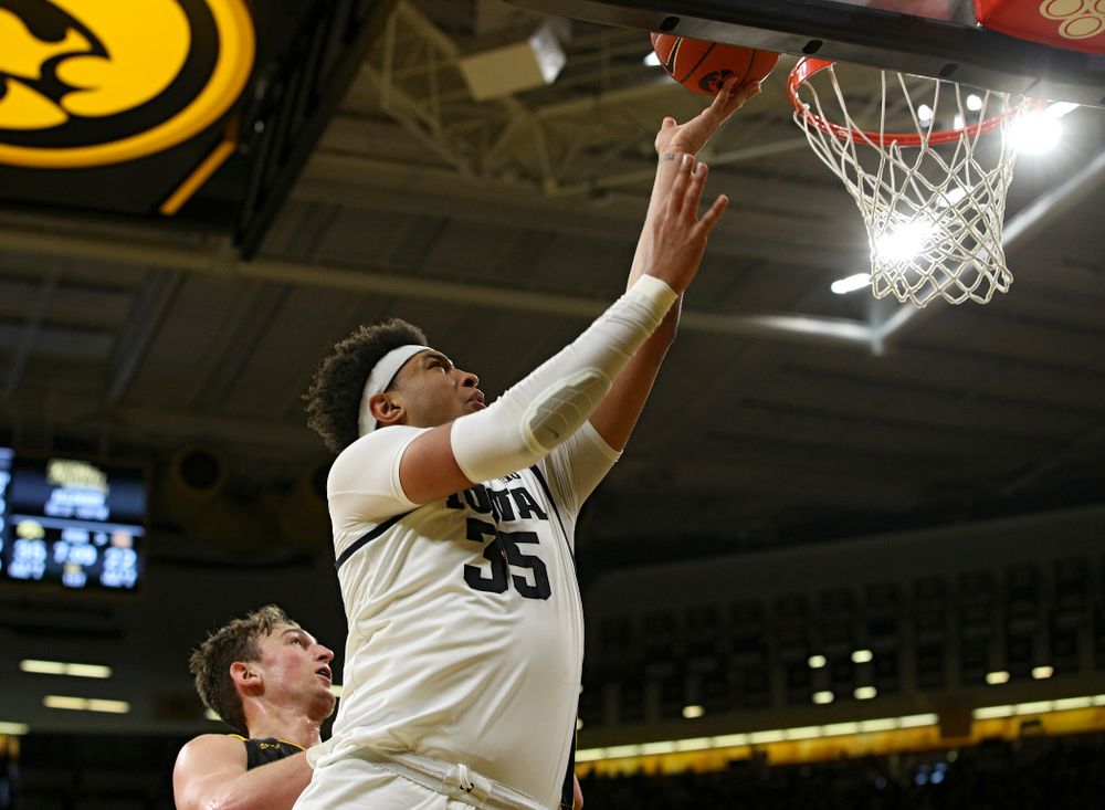 Iowa Hawkeyes forward Cordell Pemsl (35) scores a basket inside during the first half of their their game at Carver-Hawkeye Arena in Iowa City on Sunday, December 29, 2019. (Stephen Mally/hawkeyesports.com)
