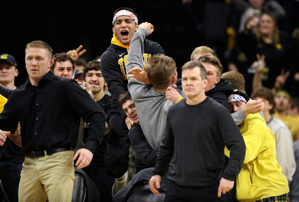 The Iowa bench cheers on cheers on Michael Kemerer in his 174-pound match during their dual at Carver-Hawkeye Arena in Iowa City on Friday, January 31, 2020. (Stephen Mally/hawkeyesports.com)
