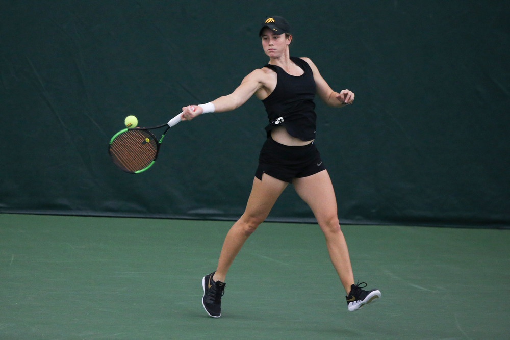 Iowa’s Elise van Heuvelen returns a hit during the Iowa women’s tennis meet vs DePaul on Friday, February 21, 2020 at the Hawkeye Tennis and Recreation Complex. (Lily Smith/hawkeyesports.com)