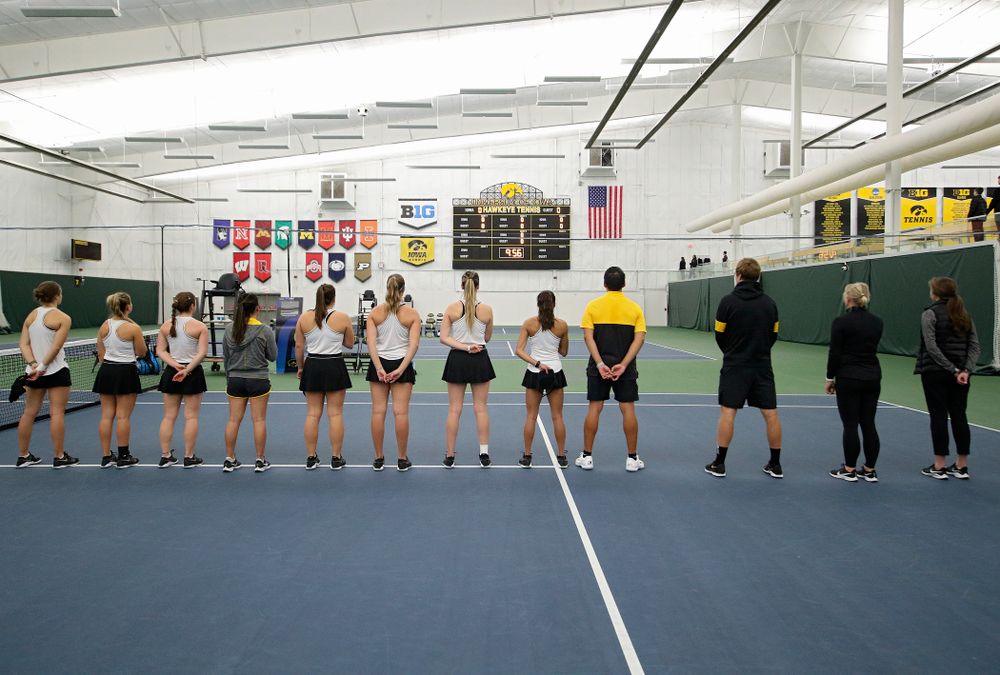 The Hawkeyes stand for the National Anthem before their match at the Hawkeye Tennis and Recreation Complex in Iowa City on Sunday, February 16, 2020. (Stephen Mally/hawkeyesports.com)