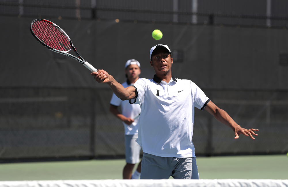 IowaÕs Oliver Okonkwo and Will Davies play a doubles match against the Michigan Wolverines Sunday, April 21, 2019 at the Hawkeye Tennis and Recreation Complex. (Brian Ray/hawkeyesports.com)