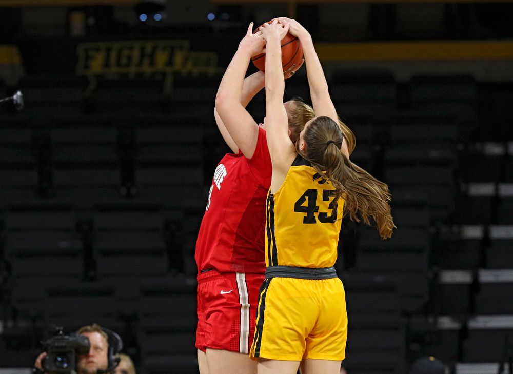 Iowa Hawkeyes forward Amanda Ollinger (43) blocks a shot by Ohio State Buckeyes forward Rebeka Mikulasikova (23) during the third quarter of their game at Carver-Hawkeye Arena in Iowa City on Thursday, January 23, 2020. (Stephen Mally/hawkeyesports.com)