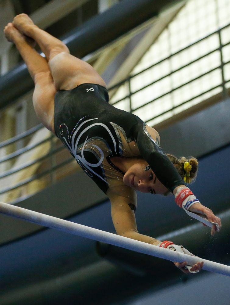 Emma Hartzler competes on the uneven bars during the Black and Gold Intrasquad meet at the Field House on 12/2/17. (Tork Mason/hawkeyesports.com)