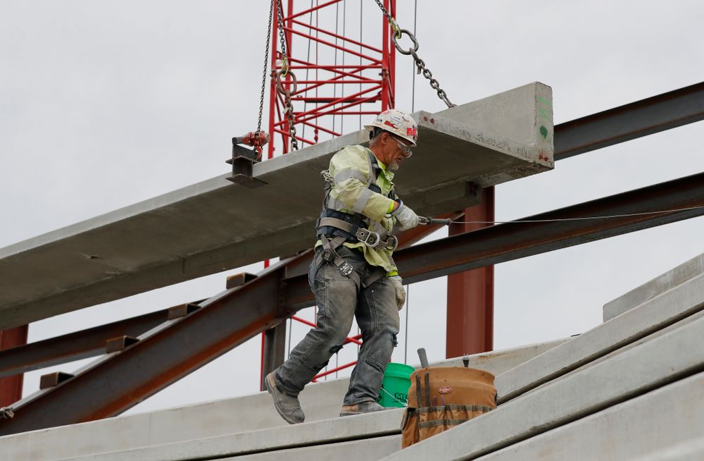 A section of precast concrete is lifted into place on the third deck of the north end zone Wednesday, June 6, 2018 at Kinnick Stadium. (Brian Ray/hawkeyesports.com)