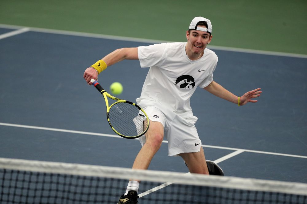Iowa’ Nikita Snezhko plays a shot against Cornell Sunday, March 8, 2020 at the Hawkeye Tennis and Recreation Center. (Brian Ray/hawkeyesports.com)