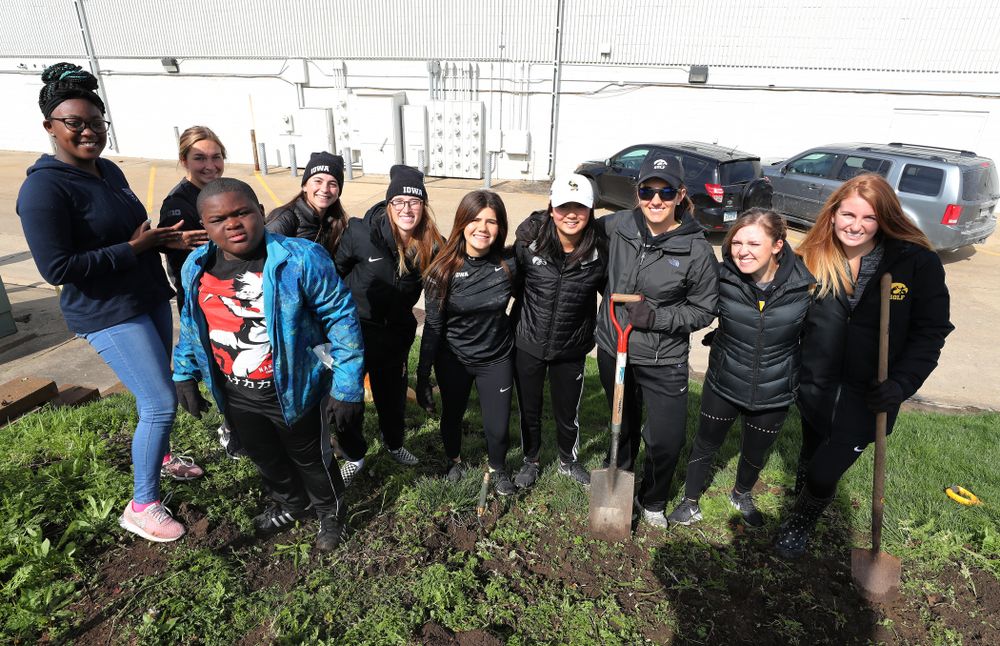 Members of the WomenÕs Golf team volunteer with the South District Neighborhood Clean-up during the annual Iowa Athletics Day of Caring Sunday, April 28, 2019 in Iowa City. (Brian Ray/hawkeyesports.com)