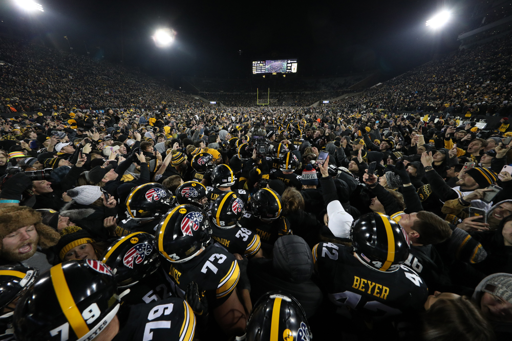The Iowa Hawkeyes celebrate with the Floyd of Rosedale Trophy following their 23-19 victory over the Minnesota Golden Gophers Saturday, November 16, 2019 at Kinnick Stadium. (Brian Ray/hawkeyesports.com)