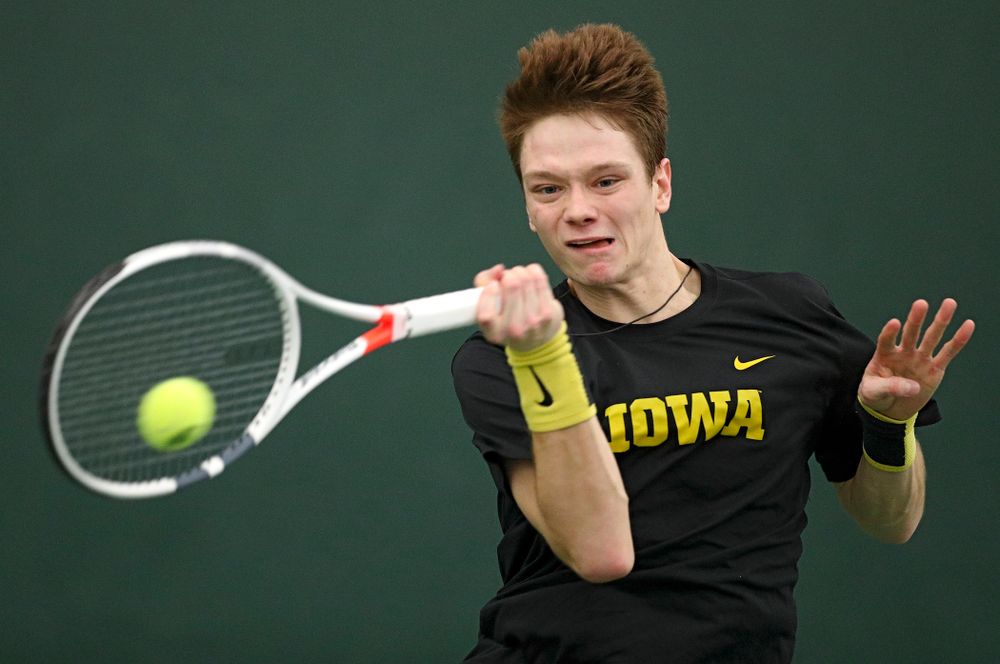 Iowa’s Jason Kerst hits a shot during his match against Marquette at the Hawkeye Tennis and Recreation Complex in Iowa City on Saturday, January 25, 2020. (Stephen Mally/hawkeyesports.com)