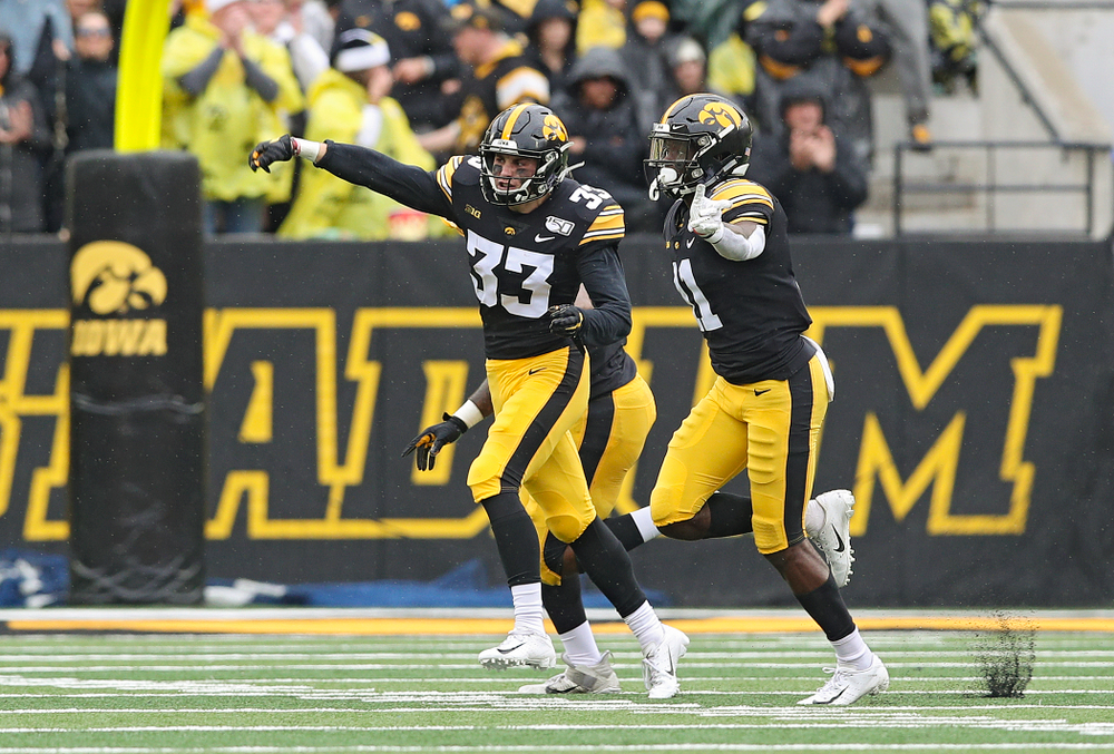 Iowa Hawkeyes defensive back Riley Moss (33) celebrates after intercepting a pass during the third quarter of their game at Kinnick Stadium in Iowa City on Saturday, Oct 19, 2019. (Stephen Mally/hawkeyesports.com)