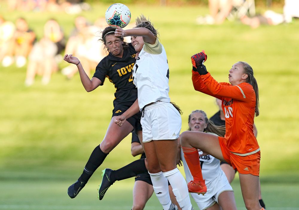 Iowa forward Kaleigh Haus (4) scores a goal with a header during the first half of their match against Western Michigan at the Iowa Soccer Complex in Iowa City on Thursday, Aug 22, 2019. (Stephen Mally/hawkeyesports.com)