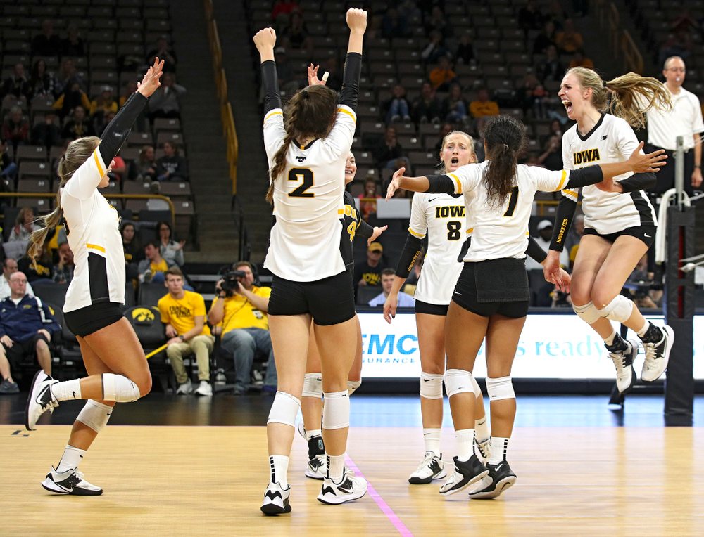 Iowa’s Maddie Slagle (15), Courtney Buzzerio (2), Halle Johnston (4), Kyndra Hansen (8), Brie Orr (7), and Hannah Clayton (18) celebrate a score during the third set of their volleyball match at Carver-Hawkeye Arena in Iowa City on Sunday, Oct 13, 2019. (Stephen Mally/hawkeyesports.com)