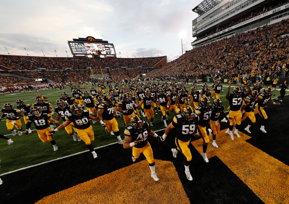 The Iowa Hawkeyes run to get the Cy-Hawk trophy following their game against the Iowa State Cyclones Saturday, September 8, 2018 at Kinnick Stadium. (Brian Ray/hawkeyesports.com)