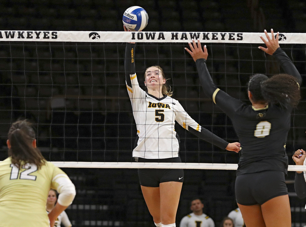 Iowa’s Meghan Buzzerio (5) tips the ball over the net during the third set of their Big Ten/Pac-12 Challenge match against Colorado at Carver-Hawkeye Arena in Iowa City on Friday, Sep 6, 2019. (Stephen Mally/hawkeyesports.com)