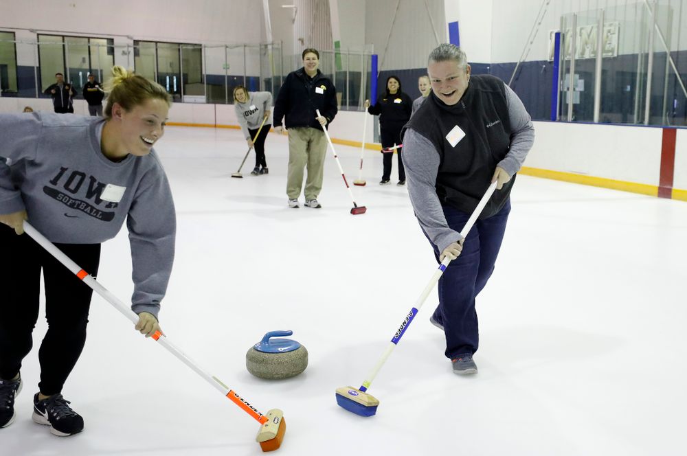 Members of the Iowa Softball team learn the sport of curling as part of a team building event Wednesday, January 10, 2018 at the Cedar Rapids Ice Arena. (Brian Ray/hawkeyesports.com)