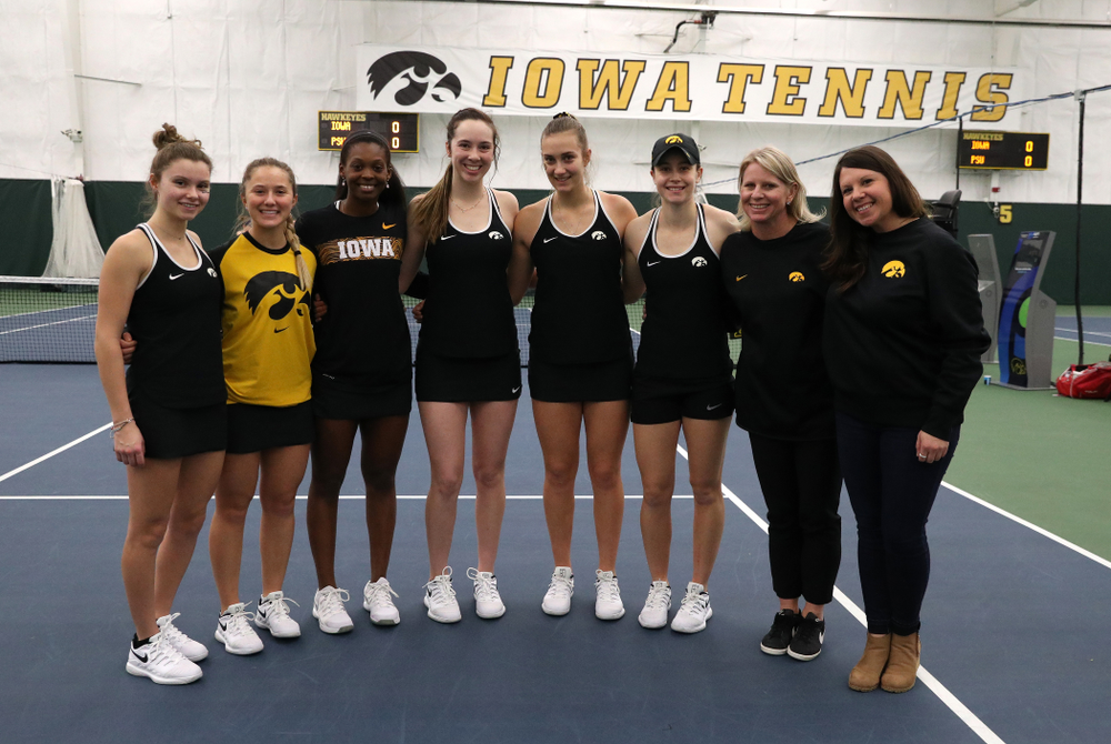 Academic Student Services Associate Director Kara Park and head coach Sash Schmid congratulate Danielle Burich, Adorabol Huckleby, Ashleigh Jacobs, Samantha Mannix, Cloe Ruette, and Elise Van Heuvelen for earning a 3.0 GPA or better during the fall semester before their match against the Penn State Nittany Lions Sunday, February 24, 2019 at the Hawkeye Tennis and Recreation Complex. (Brian Ray/hawkeyesports.com)