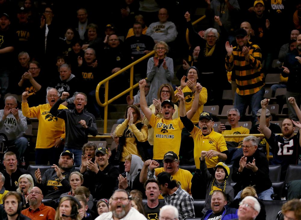 Fans cheer on IowaÕs Austin DeSanto as he wrestles WisconsinÕs Seth Gross at 133 pounds Sunday, December 1, 2019 at Carver-Hawkeye Arena. DeSanto won the match 6-2. (Brian Ray/hawkeyesports.com)
