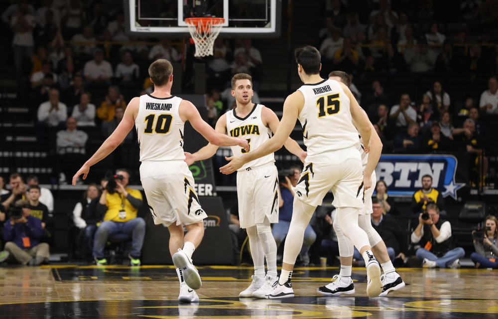 Iowa Hawkeyes guard Joe Wieskamp (10), guard Jordan Bohannon (3), and forward Ryan Kriener (15) against the Illinois Fighting Illini Sunday, January 20, 2019 at Carver-Hawkeye Arena. (Brian Ray/hawkeyesports.com)