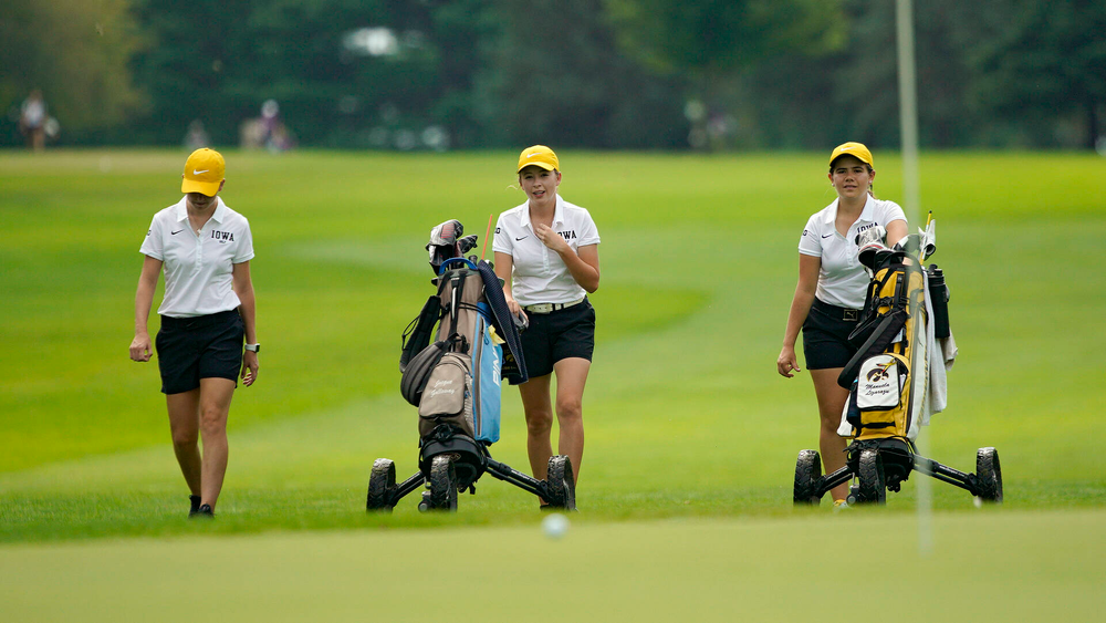Iowa’s Lea Zeitler (from left), Jacquelyn Galloway, and Manuela Lizarazu walk together during their dual against Northern Iowa at Pheasant Ridge Golf Course in Cedar Falls on Monday, Sep 2, 2019. (Stephen Mally/hawkeyesports.com)