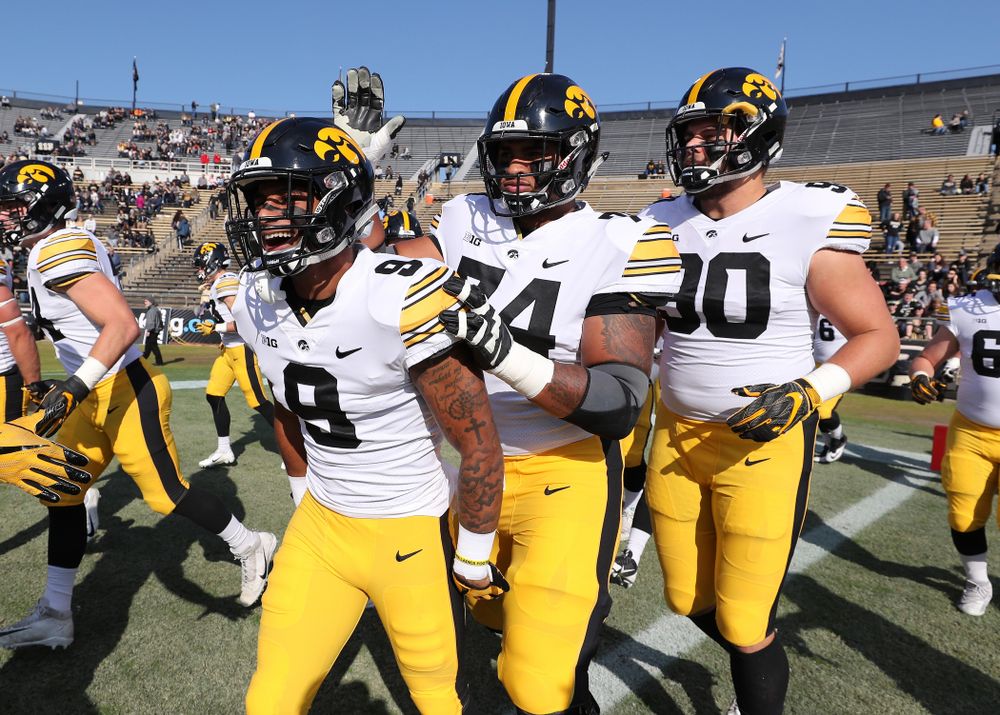Iowa Hawkeyes defensive back Geno Stone (9) and offensive lineman Tristan Wirfs (74) against the Purdue Boilermakers Saturday, November 3, 2018 Ross Ade Stadium in West Lafayette, Ind. (Brian Ray/hawkeyesports.com)