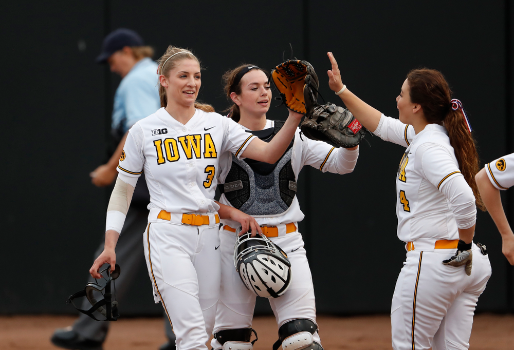Iowa Hawkeyes starting pitcher/relief pitcher Allison Doocy (3) and infielder Taylor Libby (4) against the Minnesota Golden Gophers Thursday, April 12, 2018 at Bob Pearl Field. (Brian Ray/hawkeyesports.com)