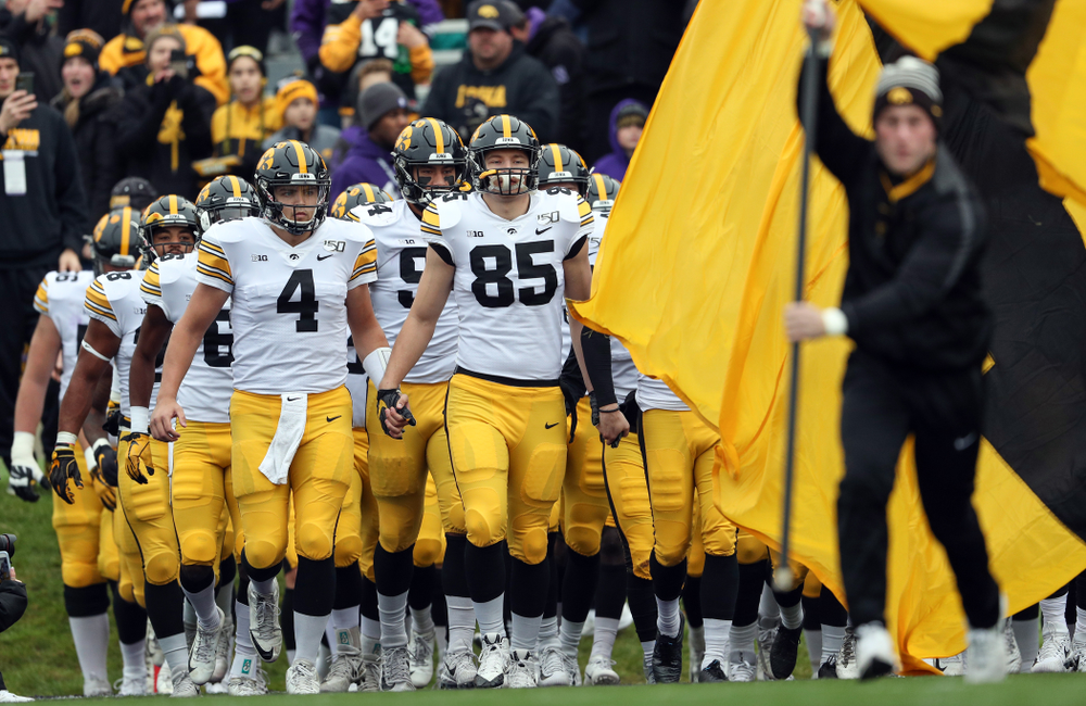 The Iowa Hawkeyes swarm the field against the Northwestern Wildcats Saturday, October 26, 2019 at Ryan Field in Evanston, Ill. (Brian Ray/hawkeyesports.com)