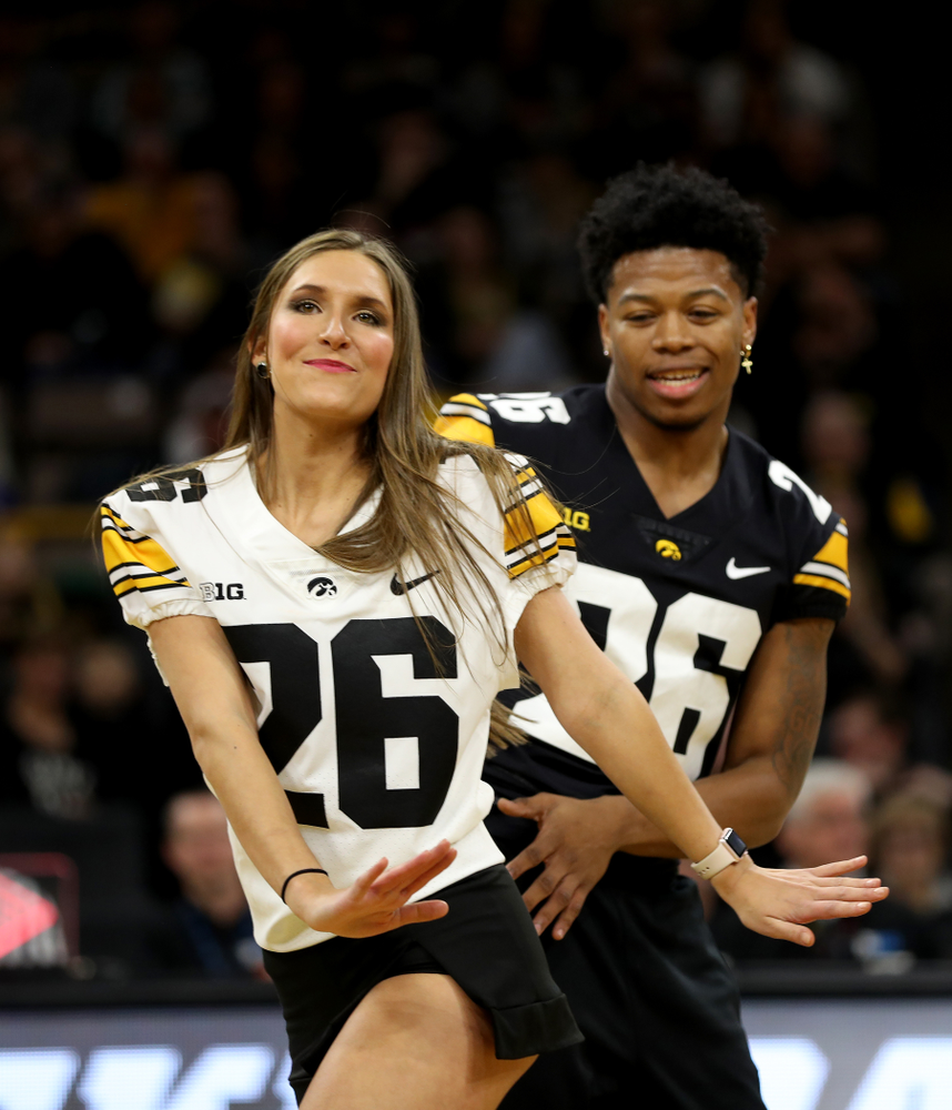 Members of the Hawkeye Football team performs with the Iowa Dance Team at halftime of the Iowa Hawkeyes game against the Ohio State Buckeyes Thursday, February 20, 2020 at Carver-Hawkeye Arena. (Brian Ray/hawkeyesports.com)