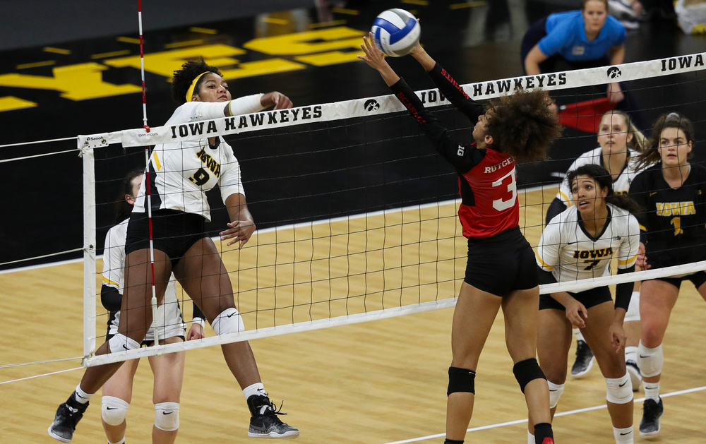 Iowa Hawkeyes middle blocker Amiya Jones (9) spikes the ball during a match against Rutgers at Carver-Hawkeye Arena on November 2, 2018. (Tork Mason/hawkeyesports.com)