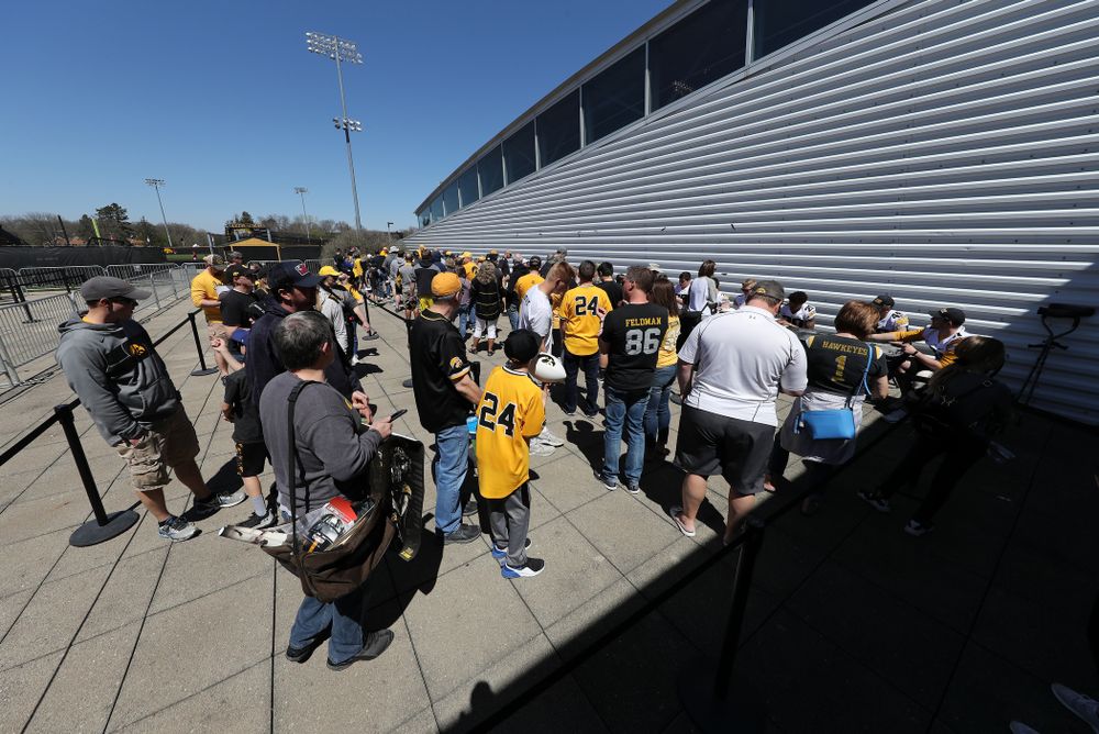 Members of the Iowa Football team sign autographs before the Iowa Hawkeyes game against the Nebraska Cornhuskers Saturday, April 20, 2019 at Duane Banks Field. (Brian Ray/hawkeyesports.com)