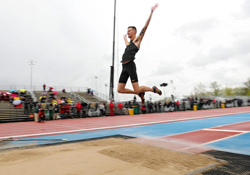 Iowa's Cooper Koenig jump in the men’s long jump event on the second day of the Big Ten Outdoor Track and Field Championships at Francis X. Cretzmeyer Track in Iowa City on Saturday, May. 11, 2019. (Stephen Mally/hawkeyesports.com)