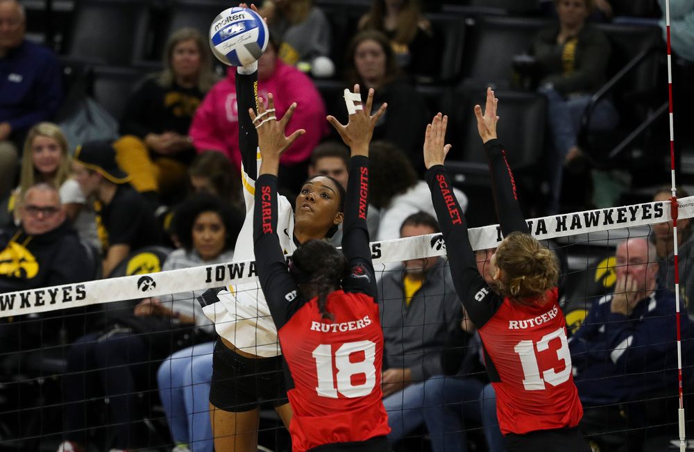 Iowa Hawkeyes outside hitter Taylor Louis (16) spikes the ball during a match against Rutgers at Carver-Hawkeye Arena on November 2, 2018. (Tork Mason/hawkeyesports.com)
