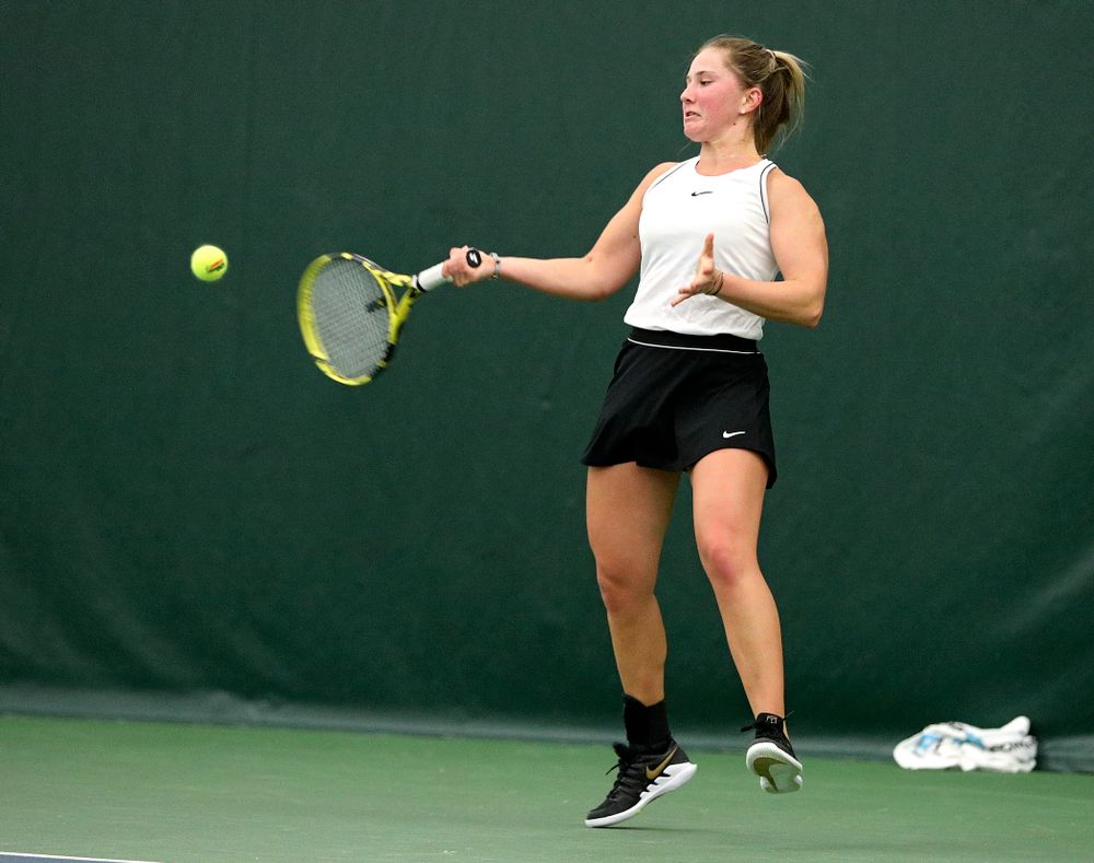 Iowa’s Danielle Burich returns a shot during her singles match at the Hawkeye Tennis and Recreation Complex in Iowa City on Sunday, February 16, 2020. (Stephen Mally/hawkeyesports.com)